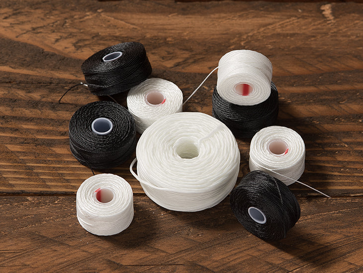 Pre wound Black and White Polyester UV Bobbin Thread V92 #30 Black & White set (24pcs). Hembob V‑92 Style A