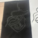 A black fabric with a white Sashiko Stitches outline showing the matching sketch on the paper.
Done by BabyLock Sashiko BLQK Sewing Machine | Traditional Japanese Hand Stitch Machine. 