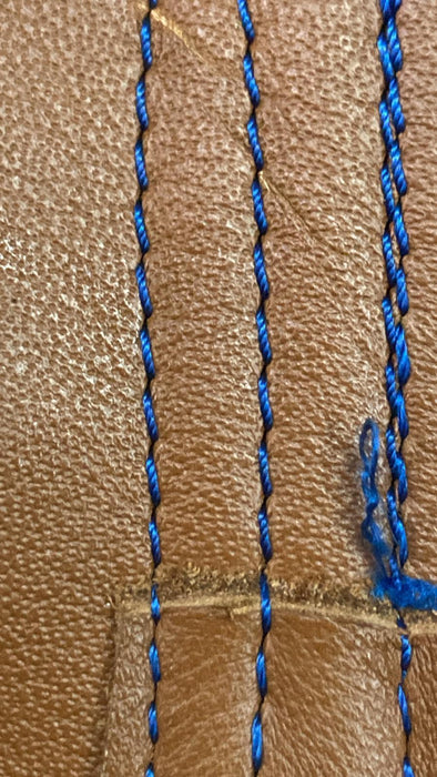 Close-up of brown leather with LR Needle Point effects.