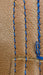 Close-up of brown leather with LR Needle Point effects.